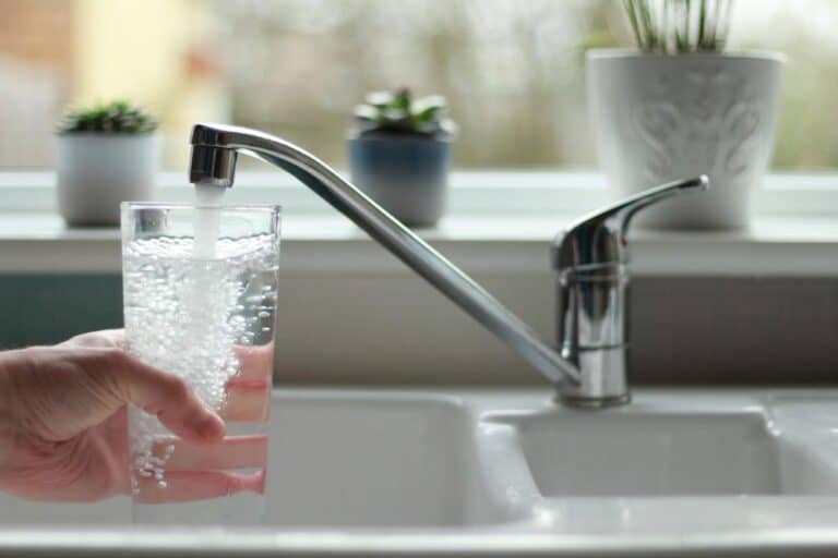 Water Being Poured Into Glass From Kitchen Tap