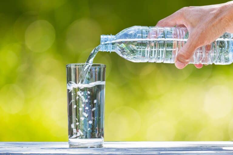 Pouring Spring Water From A Bottle