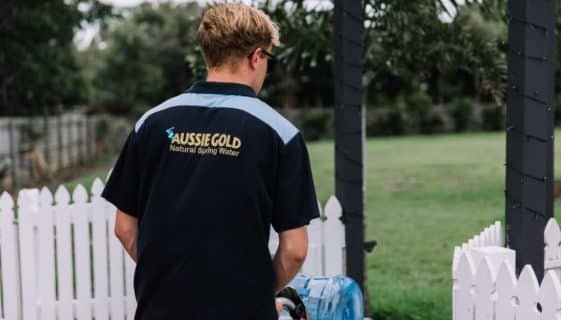 Man Delivering Gallons Of Spring Water — Spring Water Online in Gracemere, QLD