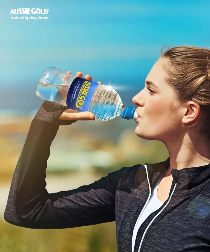 Woman Drinking Bottled Spring Water From Aussie Gold