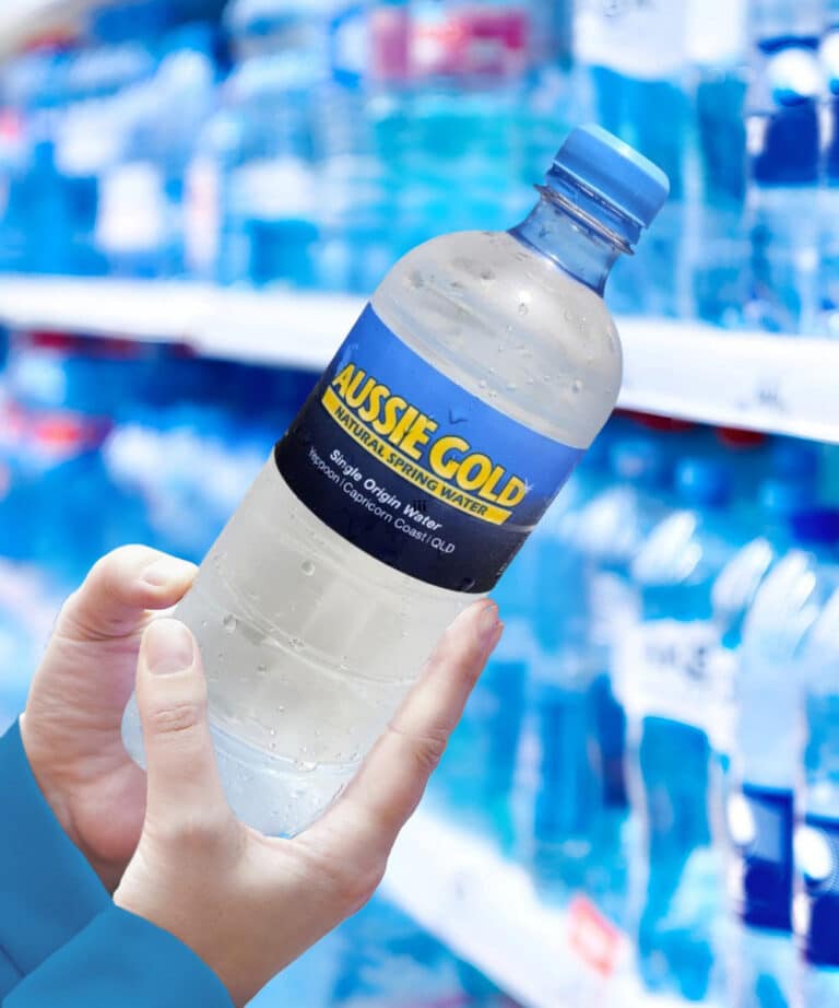 Hands Holding Bottled Spring Water