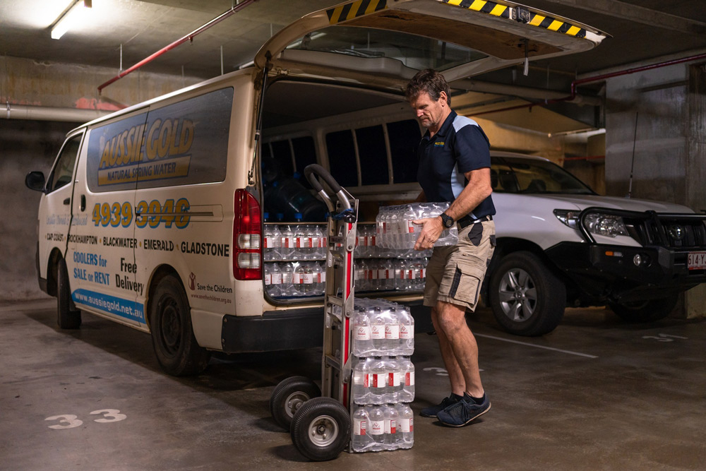 Man Delivering A Water Bottle
