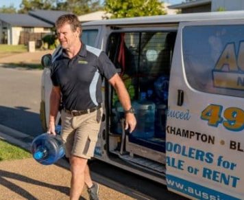 Man Carrying A Gallon Of Spring Water — Spring Water Online in Agnes Water, QLD