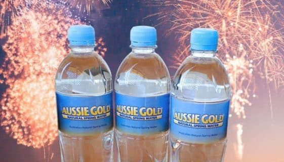 Bottle Of Spring Waters With Fireworks In The Background — Spring Water Online in Agnes Water, QLD