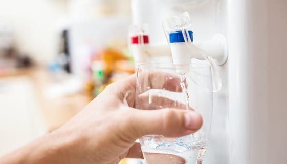 Pouring Water from Dispenser — Spring Water Online in Isaac, QLD