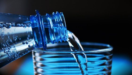 Pouring Water From Bottle to Glass — Spring Water Online in Mackay, QLD