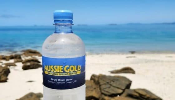 Cold Bottle Of Spring Water In A Beach — Spring Water Online in Agnes Water, QLD