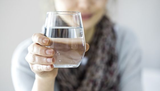 Female Holding a Glass of Clean Water — Spring Water Online in Isaac, QLD