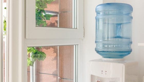 Blue Water Gallon On Electric Water Dispenser