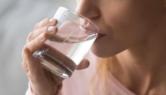 Close up Cropped Image Of A Woman Drinking Water