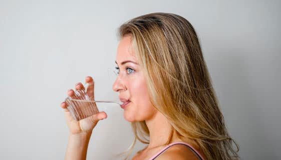 Photo Of A Woman Drinking From Plastic Cup