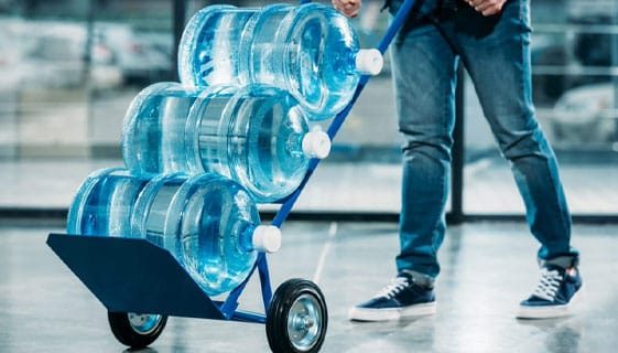 Pushing Cart With Water Delivery